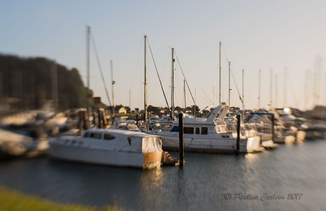 Sunset photo of sailboats on Winchester Bay, Oregon using a Lensbaby